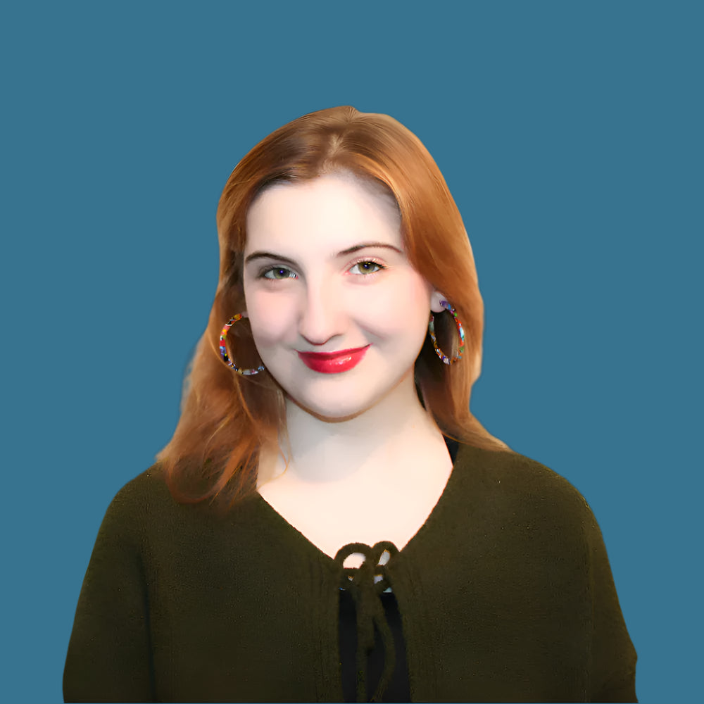 Katherine Donovan. Kat Donovan. Donni Donovan. Woman with red hair and red lipstick on a black background